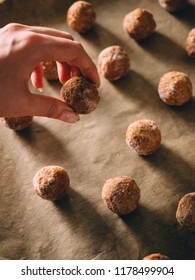 Raw Frozen Meat Balls On Baking Sheet With Paper.