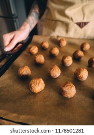 Raw Frozen Meat Balls On Baking Sheet With Paper.