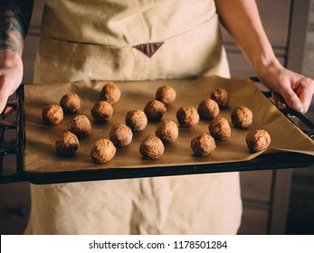 Raw Frozen Meat Balls On Baking Sheet With Paper.