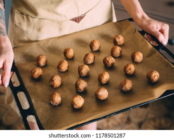 Raw Frozen Meat Balls On Baking Sheet With Paper.