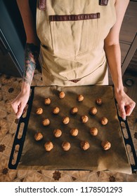 Raw Frozen Meat Balls On Baking Sheet With Paper.