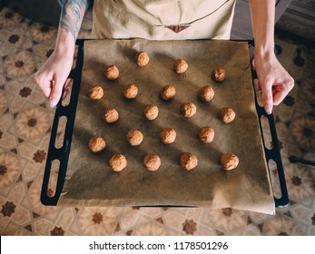 Raw Frozen Meat Balls On Baking Sheet With Paper.