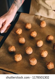 Raw Frozen Meat Balls On Baking Sheet With Paper.