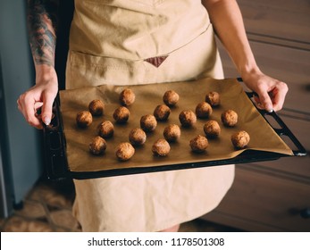 Raw Frozen Meat Balls On Baking Sheet With Paper.