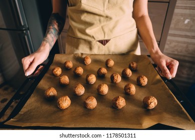 Raw Frozen Meat Balls On Baking Sheet With Paper.