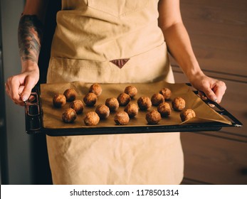 Raw Frozen Meat Balls On Baking Sheet With Paper.