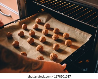 Raw Frozen Meat Balls On Baking Sheet With Paper.