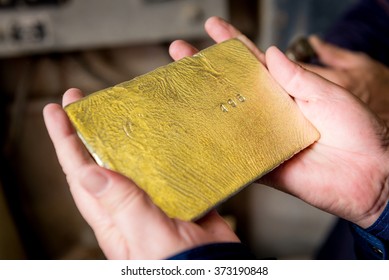 Raw Gold Ingot In The Hands