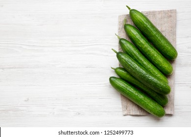 Raw Green Cucumbers, Top View. Flat Lay, Overhead, From Above. Copy Space.