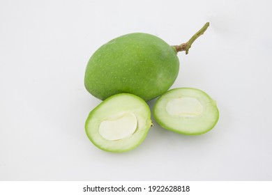 Raw Green Mango And Half Of It Isolated On White Background
