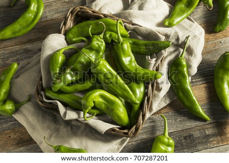 Raw Green Spicy Hatch Peppers in a Basket