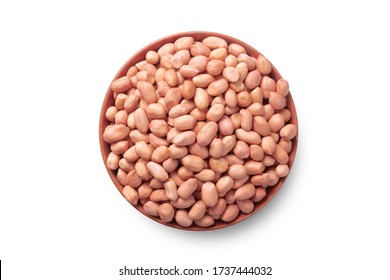 Raw Groundnuts in an earthen bowl on white background. Peanuts isolated. Top angle peanuts bowl. Peanut isolated. Raw peanuts bowl.  