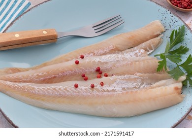 Raw Hake Fillet On A Plate