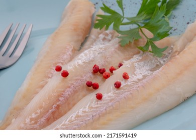 Raw Hake Fillet On A Plate