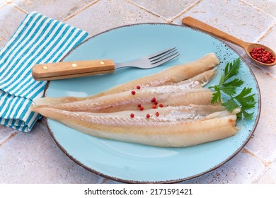 Raw Hake Fillet On A Plate