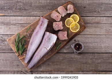 Raw Hake On Wooden Background . Ready To Cooking