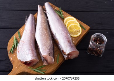 Raw Hake On Wooden Background . Ready To Cooking