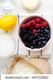 Raw Ingredients: Berries, Lemon, Flour, Sugar, Salt, Water For Cooking Berry Pie, Top View. From Above, Overhead, Flat Lay. Close-up.