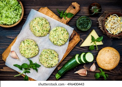 Raw Ingredients For Vegetarian Dinner Recipe. Preparing Veggies Cutlets Or Patties For Burgers. Zucchini Quinoa Veggie Burger With Pesto Sauce And Sprouts. Top View, Overhead, Flat Lay