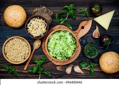 Raw Ingredients For Vegetarian Dinner Recipe. Preparing Veggies Cutlets Or Patties For Burgers. Zucchini Quinoa Veggie Burger With Pesto Sauce And Sprouts. Top View, Overhead, Flat Lay