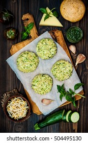 Raw Ingredients For Vegetarian Dinner Recipe. Preparing Veggies Cutlets Or Patties For Burgers. Zucchini Quinoa Veggie Burger With Pesto Sauce And Sprouts. Top View, Overhead, Flat Lay