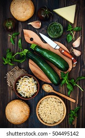 Raw Ingredients For Vegetarian Dinner Recipe. Preparing Veggies Cutlets Or Patties For Burgers. Zucchini Quinoa Veggie Burger With Pesto Sauce And Sprouts. Top View, Overhead, Flat Lay