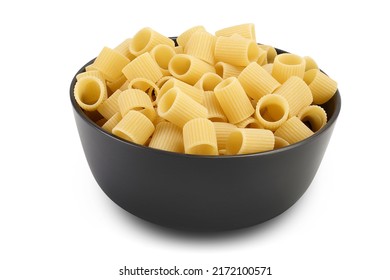 Raw Italian Pasta In Ceramic Bowl Isolated On White Background . Mezze Maniche Rigate Bronze Die