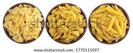 Raw italian pasta in wooden bowl isolated on white background, top view
