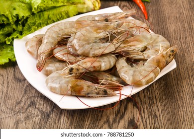 Raw King Prawn Heap In The Bowl Over Wooden Background