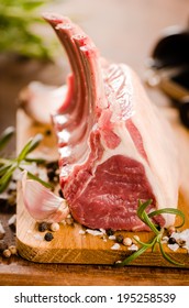 Raw lamb chops close-up on wooden background