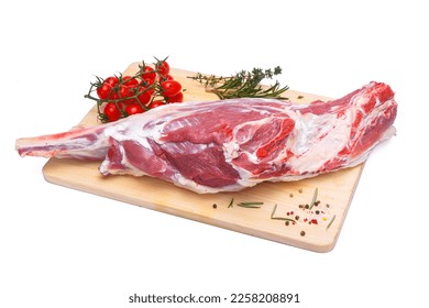 raw lamb leg with vegetables, loin on the bone with herbs, meat shoulder blade on a wooden cutting board, on a white isolated background - Powered by Shutterstock