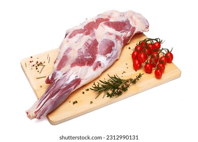 raw lamb leg with vegetables, loin on the bone with herbs, meat shoulder blade on a wooden cutting board, on a white isolated background - Powered by Shutterstock