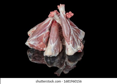 Raw Lamb Shank On Black Background. Top View. Space For Text.