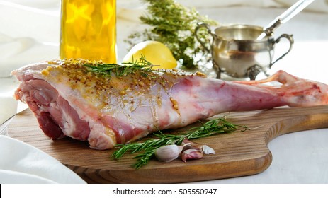 raw leg of mutton with olive oil marinade