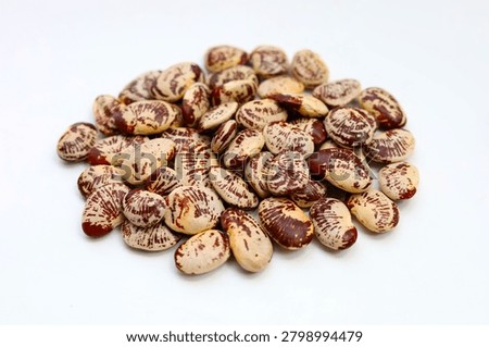 Raw lima beans on white background.