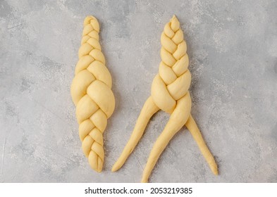 Raw loaf of challah Jewish bread on a light gray background. Top view, copy space - Powered by Shutterstock