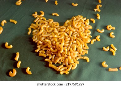 Raw Macaroni Scattered To Form A Heart Image