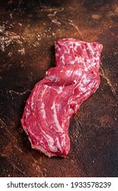 Raw Machete Skirt Beef Steak On Butcher Table. Dark Background. Top View.