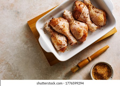 Raw marinated chicken drumstick prepared for baking. Top view. - Powered by Shutterstock