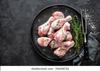 Raw marinated chicken meat, chicken legs - Shutterstock ID 765434722