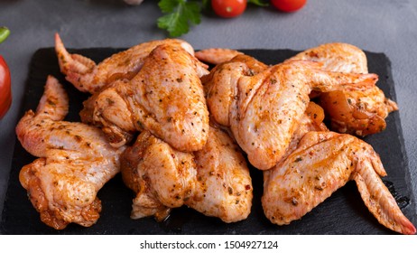 Raw Marinated Chicken  Wings In Red Sauce.