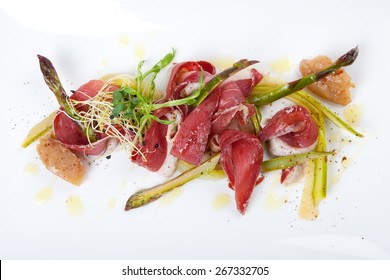 raw marinated green asparagus with sliced smoked duck breast and banana chutney