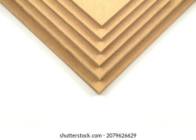 Raw MDF, cut in the shape of a triangle, turned down. It has a total of six mdf boards, one on top of the other.