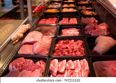 raw meat in assortment in a butcher shop