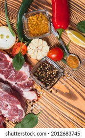 Raw Meat With Fresh Vegetables And Spices On Wooden Background. Top View. Free Space For Text. Prepare Yourself Concept