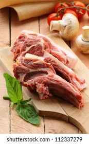 raw meat, lamb chops with vegetables