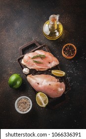 Raw Meat, Ready For Grill Or Barbeque Chicken Breast Filet, With Olive Oil, Herbs And Spices On Dark Rusty Background, Copy Space Top View