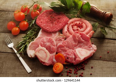 Raw Meat Selection With Herbs And Pink Pepper