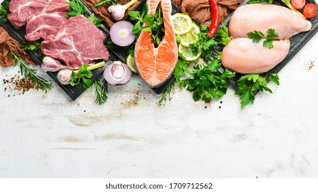 Raw Meat Set: Veal, Pork And Fish. Top View. On A White Wooden Background. Free Space For Your Text.