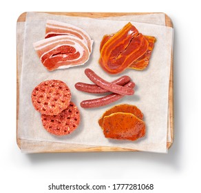 Raw meat in a studio setting, on a cutting board.